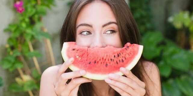A girl eats watermelon for weight loss